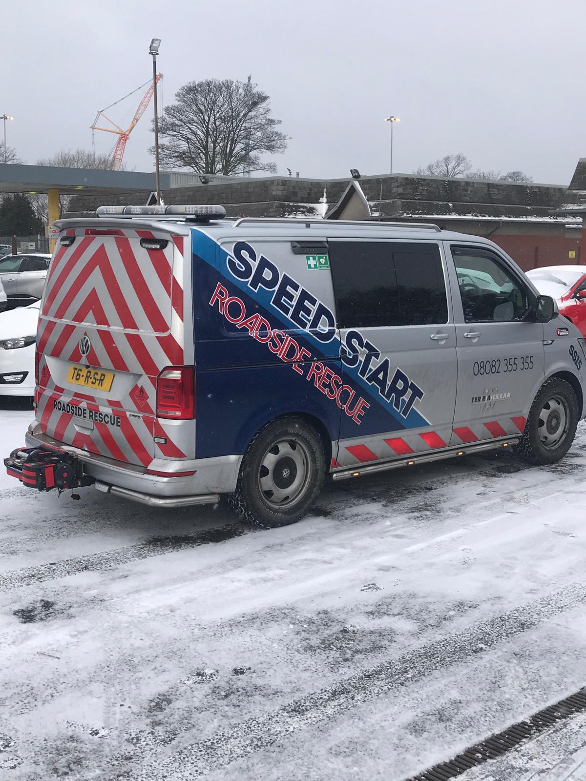 Mobile mechanic van parked outside in the snow